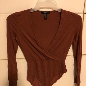 burnt orange body suit